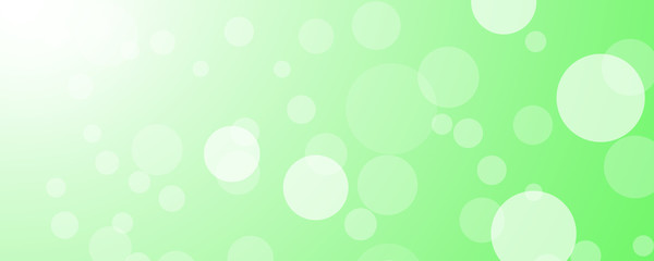 White bokeh on green background