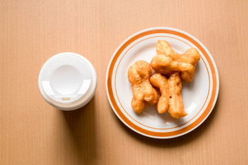 Thai style breakfast is a cup of coffee and deep fried crispy dough called Pa-Tong-Go, in the morning. Refresh your brain with caffeine for ready to work.