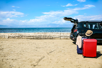 Summer car on a beautiful sunny sandy beach view.
