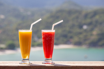 Two fresh organic shake from mango and watermelon in thai restaurant on the beach near sea in Thailand. Close up