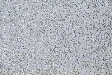 Rough wall texture, wall background, house facade with spatula technique structure.
