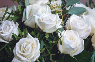 Delicate, white roses. Beautiful, fresh flowers, a festive bouquet. Floral background.