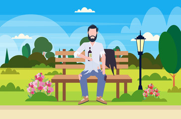 poor man drunk beggar sitting on wooden bench holding bottle of alcohol homeless jobless concept city urban park landscape background full length flat horizontal