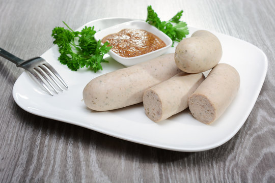 Table for Oktoberfest with wei&szlig;wurst and mostard