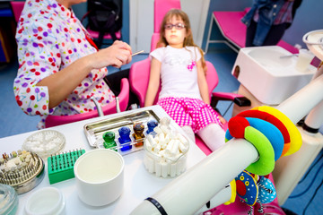 Set of dentist tools and equipment on clinic desktop