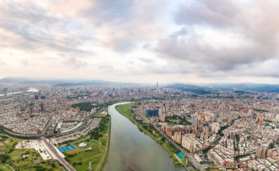 Asia business concept image, panoramic modern cityscape building bird’s eye view under sunrise and morning blue bright sky, shot in Taipei, Taiwan.