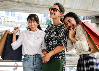 Beautiful three woman smile and happy for shopping in black Friday.