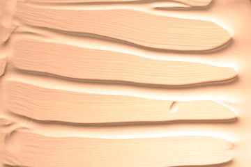 Liquid foundation texture. Make up for women. Top view.