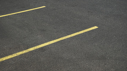 Asphalt Parking Area With Yellow Stripes
