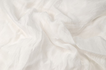 Soft smooth white silk fabric background. Fabric texture.