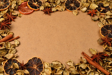 Autumn background with golden leaves, dried fruts, cinnamon and anis. Space for text or design.