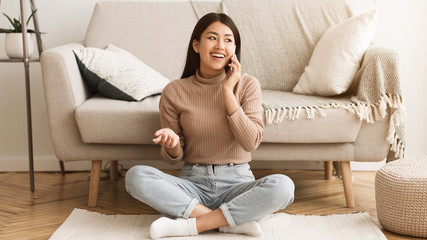 Asian Girl Communicating with Friend, Talking on Phone