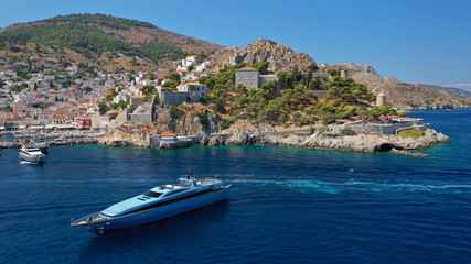 Aerial drone panoramic photo of picturesque port and main village of Hydra or Ydra island with beautiful neoclassic houses, Saronic gulf, Greece