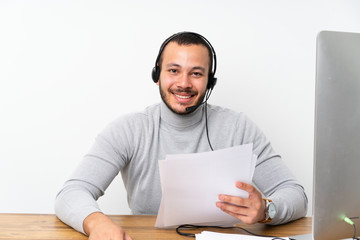 Telemarketer Colombian man working in a office