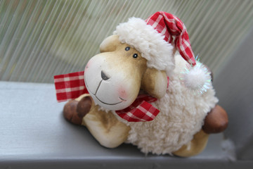 The smile teddy sheep and translucent corrugated plastic wall background.