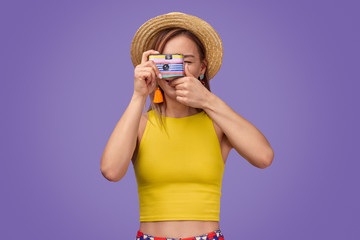Cheerful stylish lady taking photo