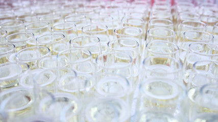 Champagne is poured into glasses before the event