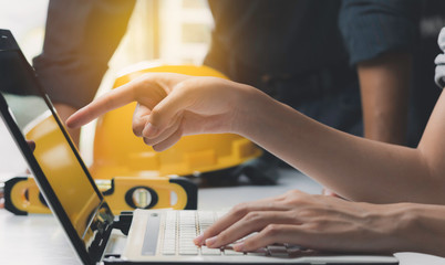 Architect engineer working concept and construction tools or safety equipment on table.