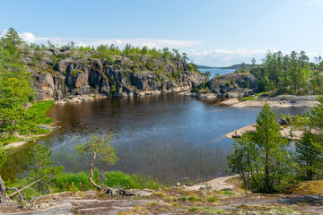 Islands in Lake Ladoga. Beautiful landscape - water, pines and boulders.