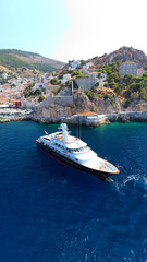 Fototapeta premium Aerial drone photo of picturesque port and main village of Hydra or Ydra island with beautiful neoclassic houses, Saronic gulf, Greece