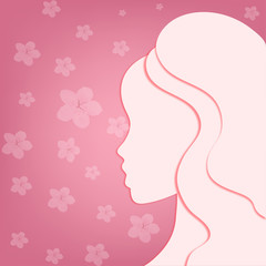 Silhouette of a girl in profile on a pink background with flowers