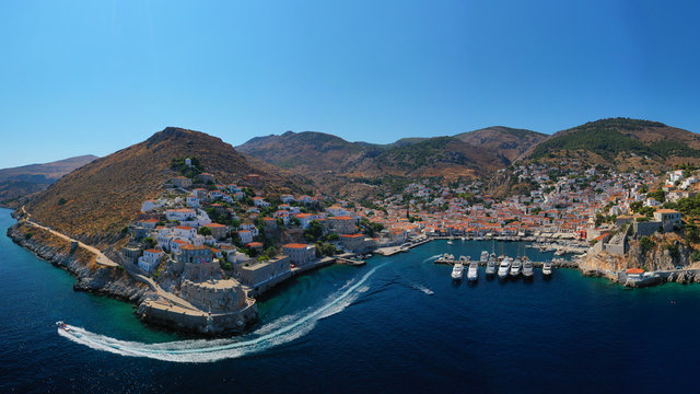 Aerial drone panoramic photo of picturesque port and main village of Hydra or Ydra island with beautiful neoclassic houses, Saronic gulf, Greece