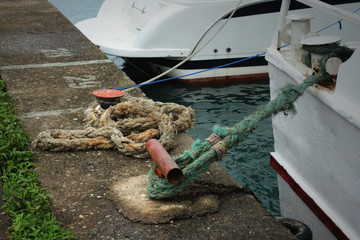 Obraz premium Old vintage sea boat. Concrete harbor