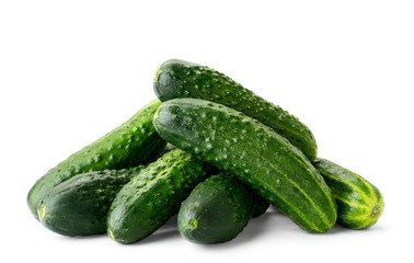 Pile of fresh ripe cucumbers close-up on a white background. Isolated