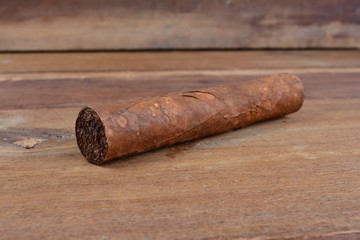 Cigars on wooden background