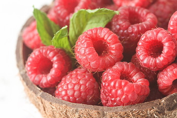 Fresh raspberries in coconut shell