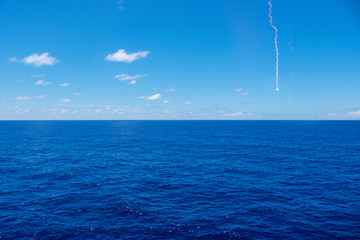 Distress signal over water horizon