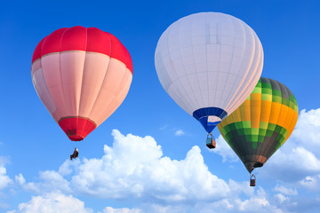 Obraz premium Colorful Hot Air Balloons in Flight over blue sky
