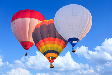 Colorful Hot Air Balloons in Flight over blue sky
