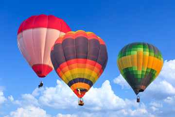 Colorful Hot Air Balloons in Flight over blue sky