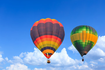 Colorful Hot Air Balloons in Flight over blue sky