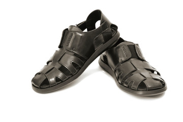 Men's black leather sandals on a white background. Copy space