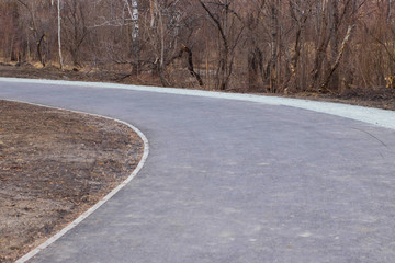 Country road leaving into the distance. Winding road turning