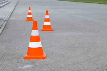 White-orange cones on the road. Road Works Fencing