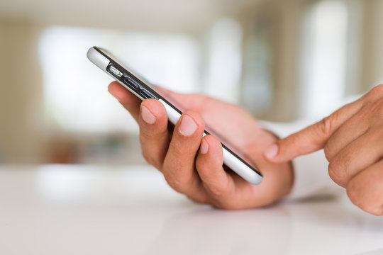 Close up of business man hands using smarpthone