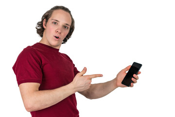 Handsome young man in t-shirt holding blank screen smartphone over white background