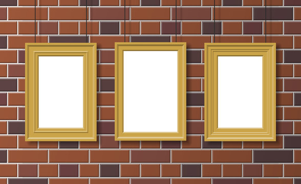 three golden picture frames hanging on brick wall mock up