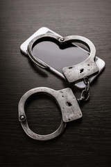 mobile phone and handcuffs