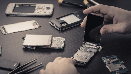 mobile phone repair, hands closeup
