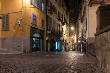 Empty night street of Bergamo town, Italy