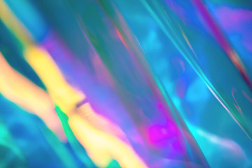 Abstract trendy holographic background in 80s style. Blurred texture in violet, pink and mint colors. Retro futurism, webpunk, disco. Neon colors.
