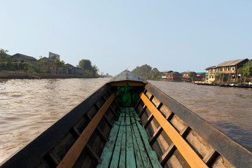 Boat going through Nampan Floating Village at Inle Lake, Nyaung Shwe, Myanmar