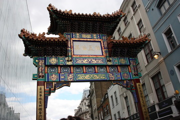 The colorful arch of entry to Chinatown in London, in the typical picturesque neighborhood