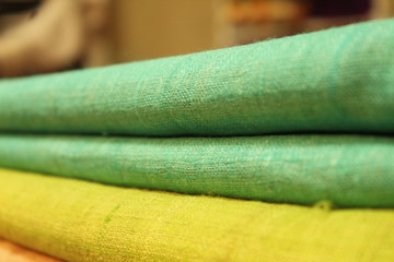 Handwoven fabric piled up at exhibition