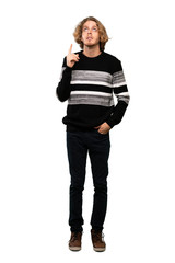 Full-length shot of Blonde man thinking an idea pointing the finger up over isolated white background