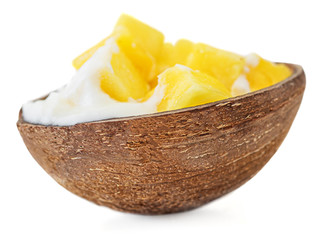Exotic Dessert made of Coconut Yogurt and sweet mango pieces. Frozen Ice-Cream isolated on white background